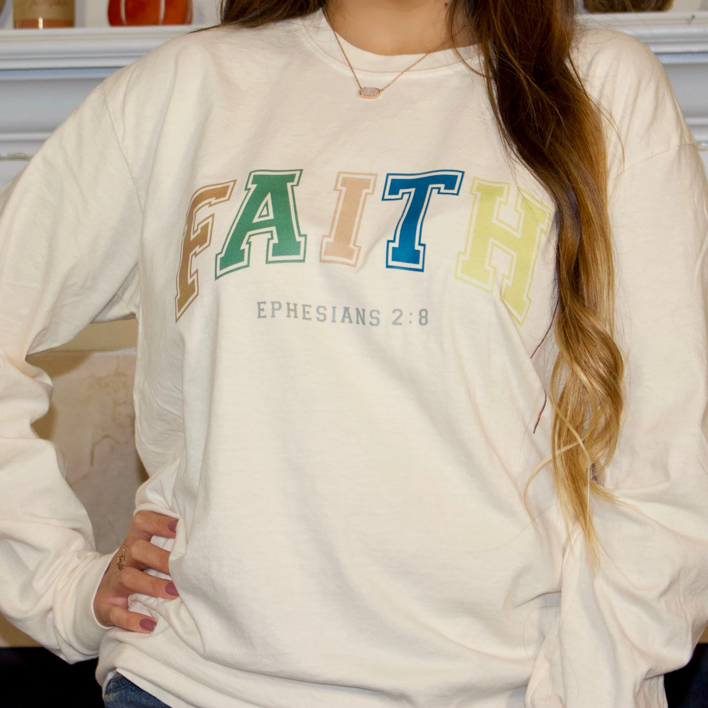 multi fall color letter print on a ivory long sleeve t-shirt with faith on it