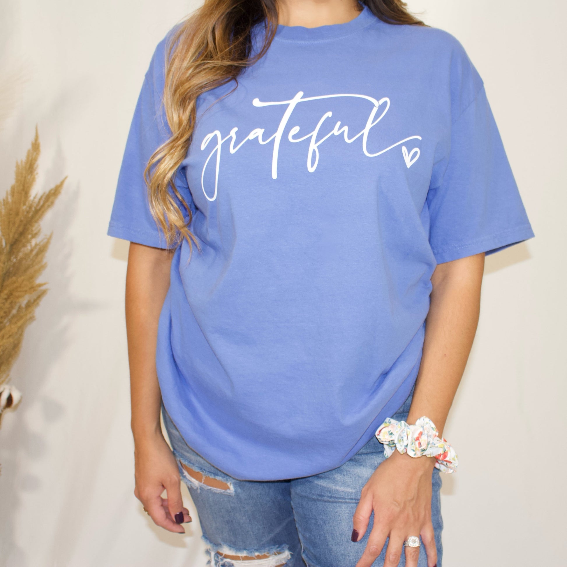 close up of mystic blue t-shirt with wording grateful and a heart