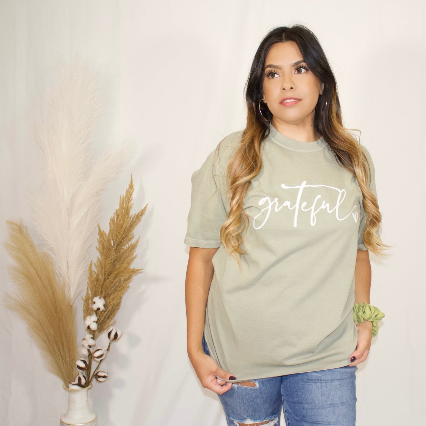 front side of sandstone green t-shirt with wording grateful