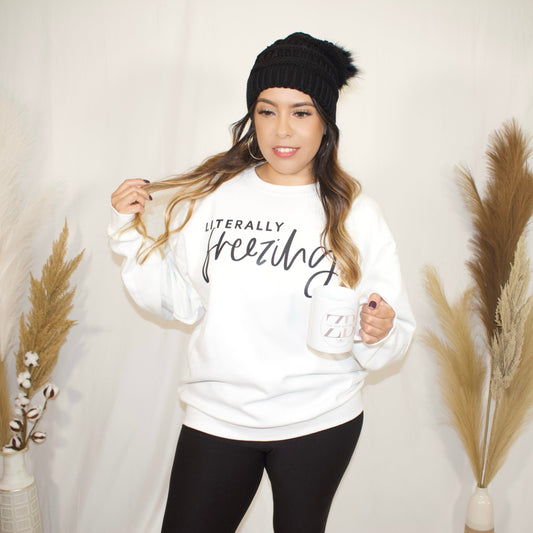 full body, close up, front side, of white sweater with wording literally freezing