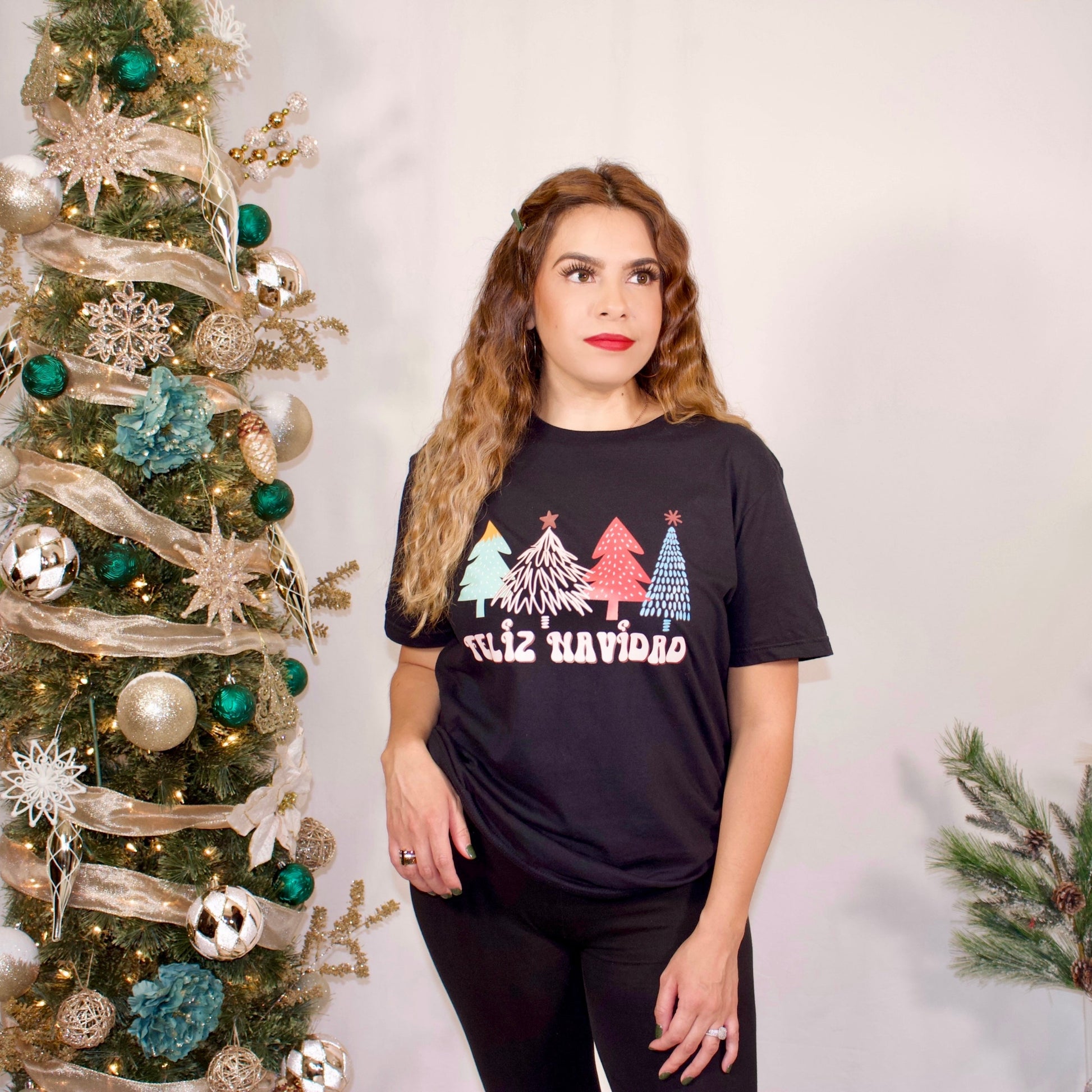 COLORFUL BLACK T SHIRT WITH GREEN, RED,PINK CHRISTMAS TREES-IT SAYS FELIZ NAVIDAD