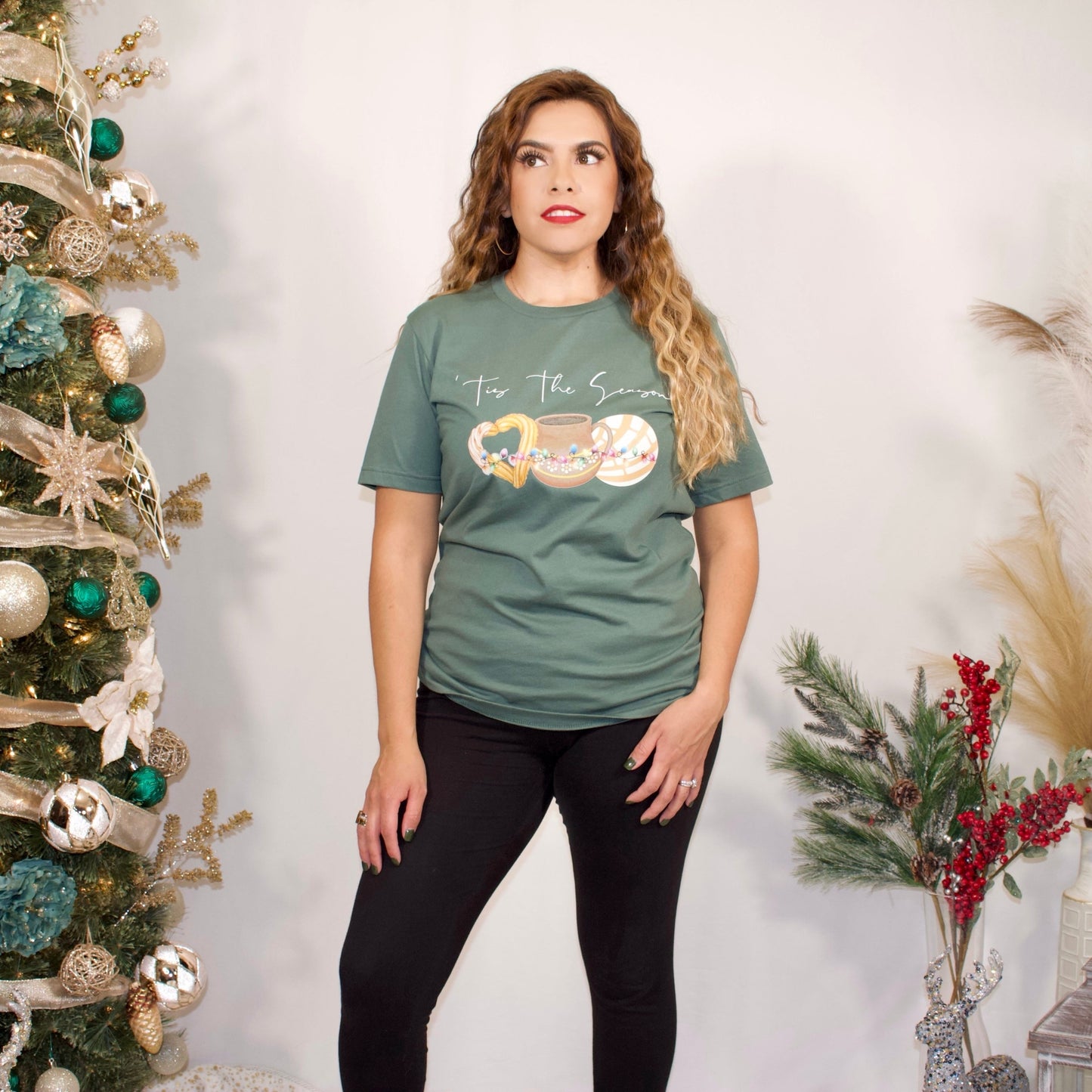 GREEN FRONT SIDE T SHIRT WITH WHITE LETTERS THAT SAYS TIS THE SEASON WITH MEXICAN BREAD