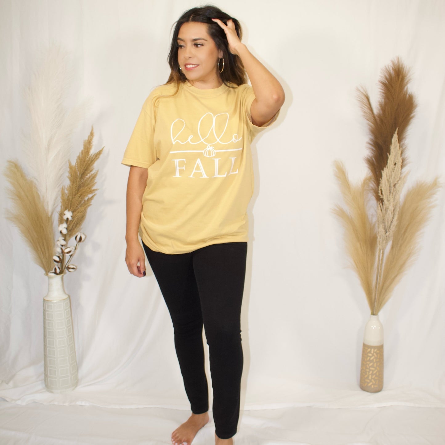 front side, full body mustard t-shirt with wording hello fall