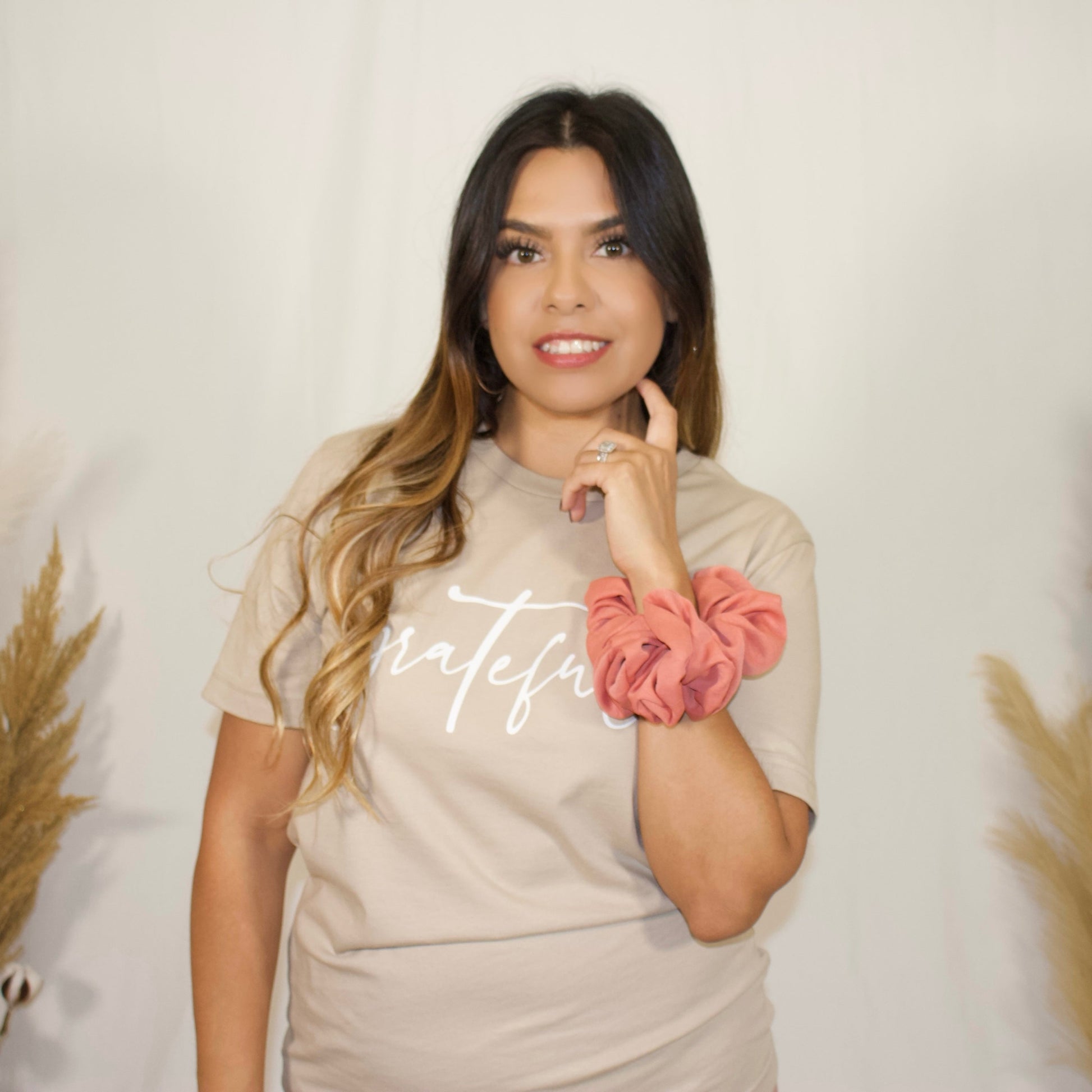 front side, close up, of terracotta jumbo scrunchie on wrist