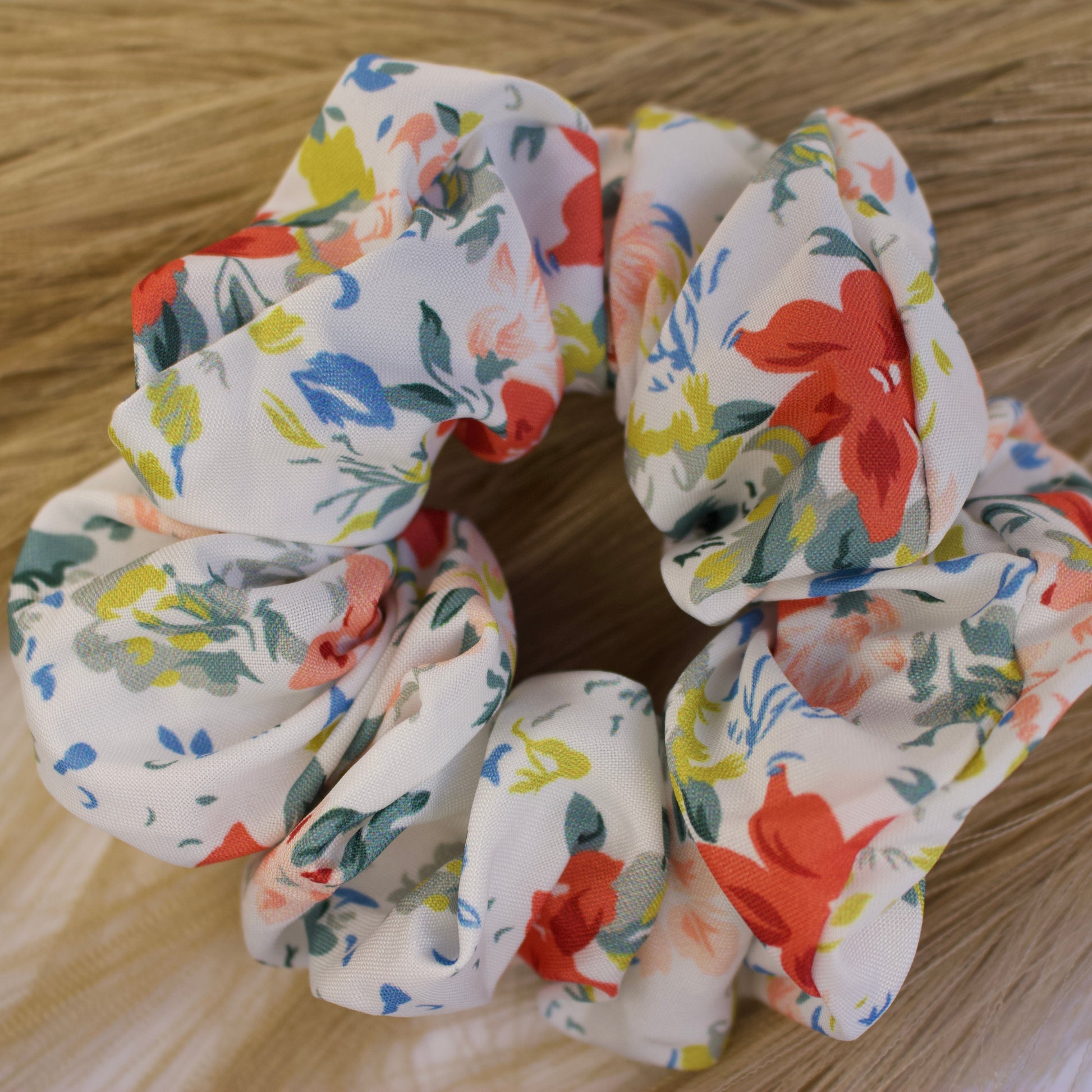 close up of colorful scrunchie- orange, blue,green 